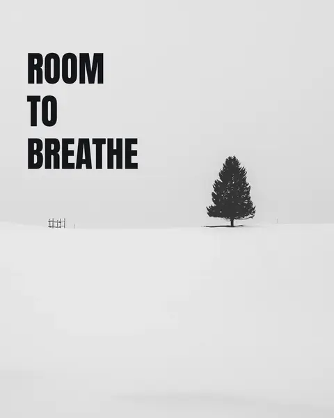A single fir tree on a white dune, with “Room to breathe” stacked in three heavy lines in the empty half of the frame